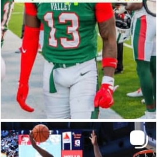 Basketball game action shot, player shooting over defender
